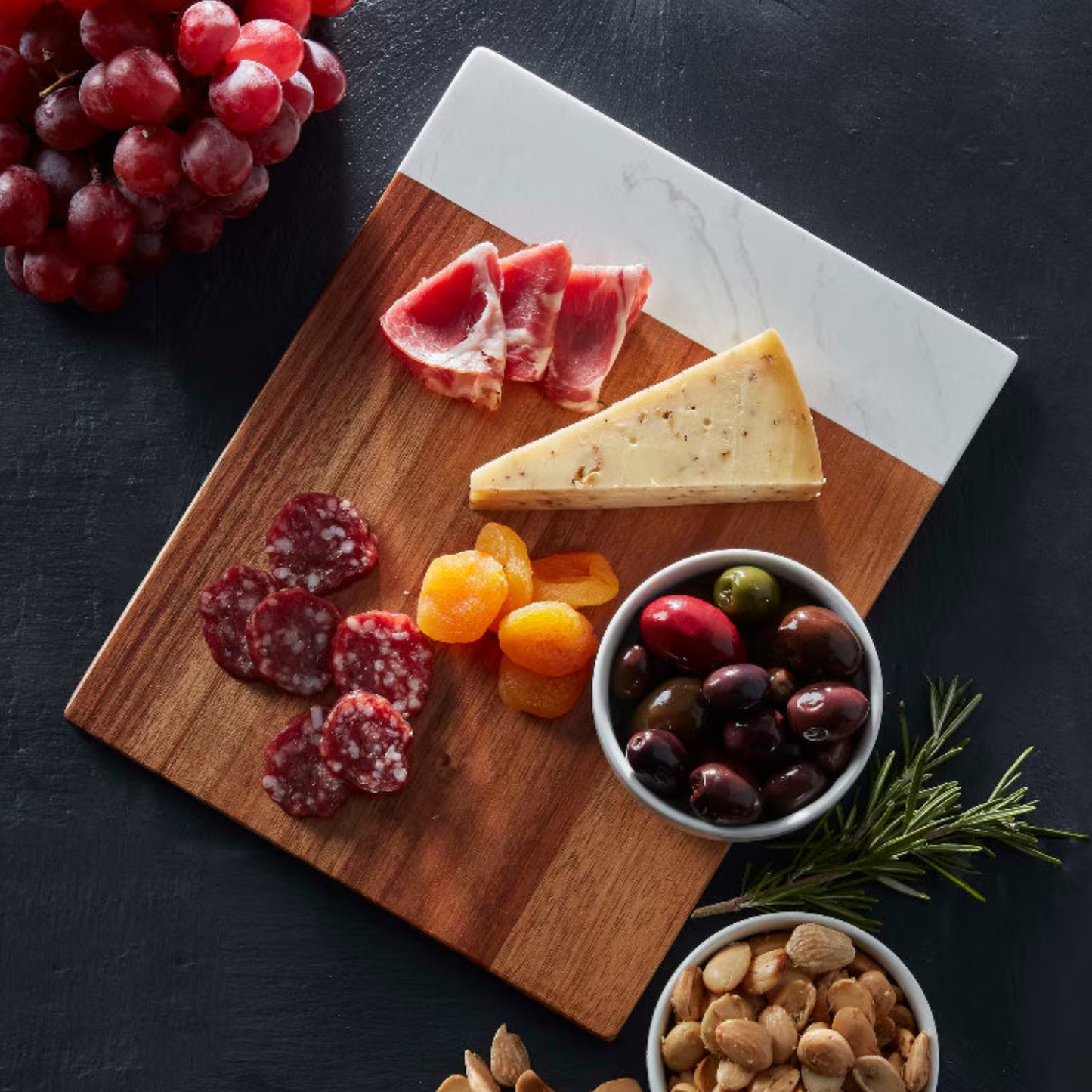 Personalized marble and acacia cutting board by Scratch That Etch for charcuterie serving and kitchen decor
