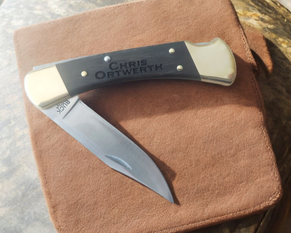 Personalized Buck 110 Folding Hunter Knife 420HC Steel Clip Point Ebony Handle Brass Bolsters With Black Leather Sheath For Camping Hunting And Eagle Scouts